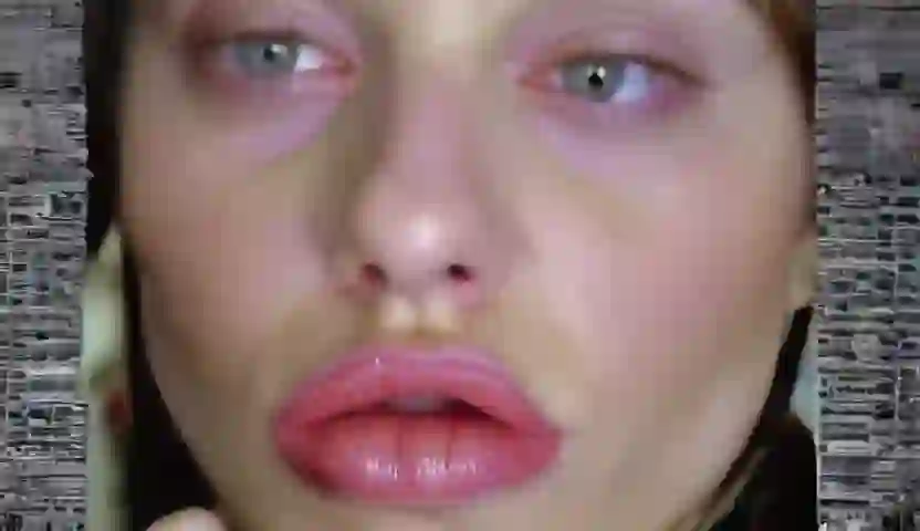 A beautiful woman with glaases and glowing yellow eyes and on Wan 2.2 I2V A14B