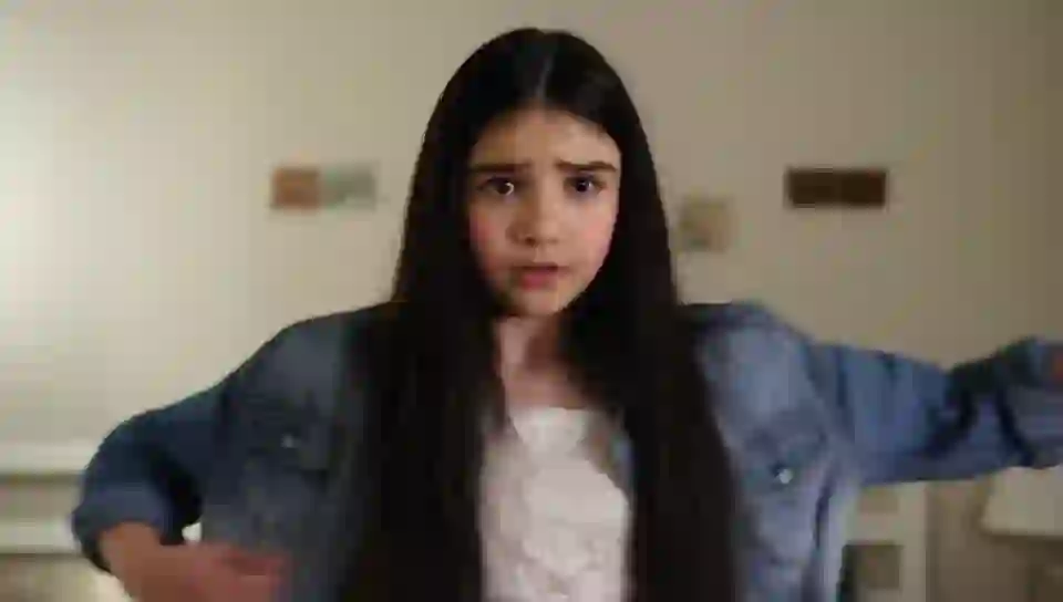 A girl with long black hair and red eyes stands on HunyuanVideo