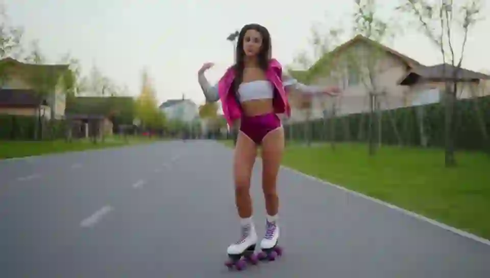 Photorealism. A naked girl rollerskates down the street and dances on HunyuanVideo