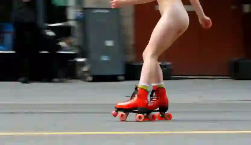 Photorealism. A naked girl rollerskates down the street and dances on Wan 2.2 T2V A14B